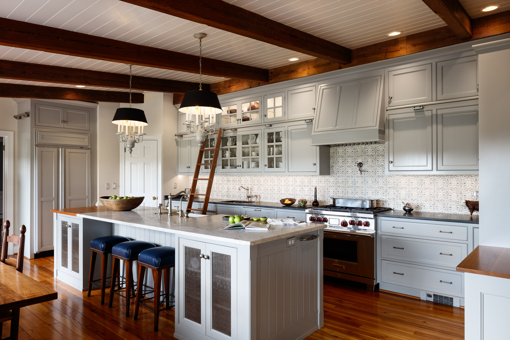 Farmhouse kitchen renovation with Antique beams pulled from barn on the farm